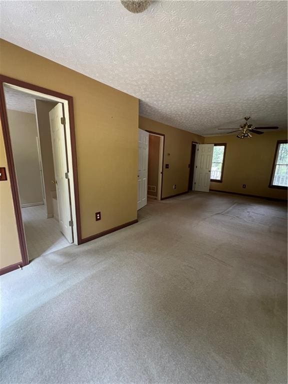 11 Seabreeze Way, Dawsonville, GA 30534 - spare room featuring ceiling fan, a textured ceiling, and light colored carpet