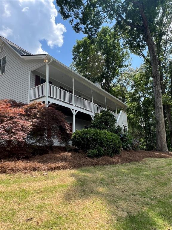 11 Seabreeze Way, Dawsonville, GA 30534 - view of home's exterior with a yard