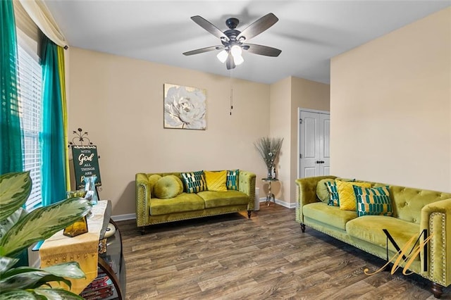 living room featuring hardwood / wood-style flooring, ceiling fan, and a healthy amount of sunlight