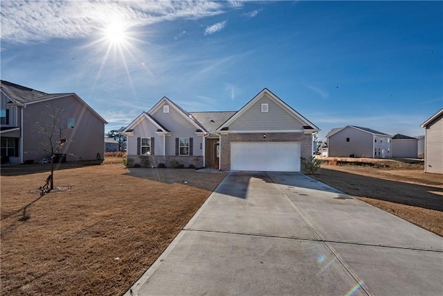 view of front of home with a garage and a front yard