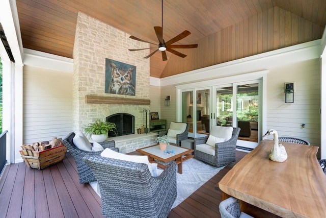 wooden terrace featuring an outdoor living space with a fireplace and ceiling fan