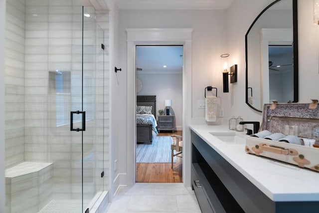 bathroom featuring vanity, tile patterned floors, and a shower with shower door