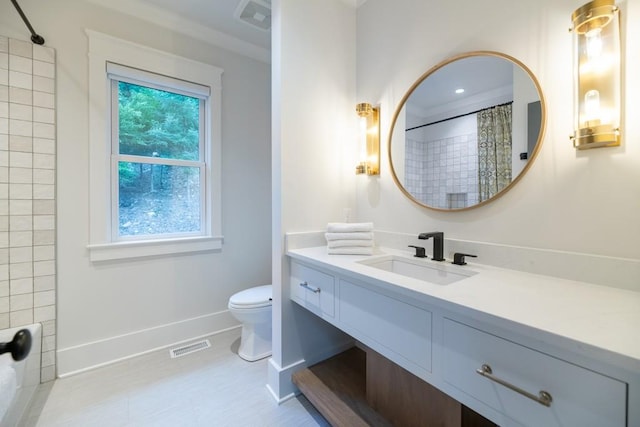 bathroom featuring curtained shower, vanity, a healthy amount of sunlight, and toilet