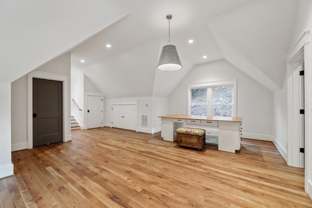 bonus room with light hardwood / wood-style floors and lofted ceiling