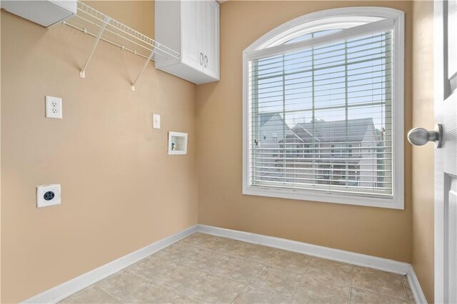 laundry room with cabinets, hookup for a washing machine, and hookup for an electric dryer