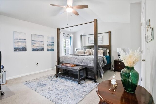 carpeted bedroom featuring ceiling fan and vaulted ceiling