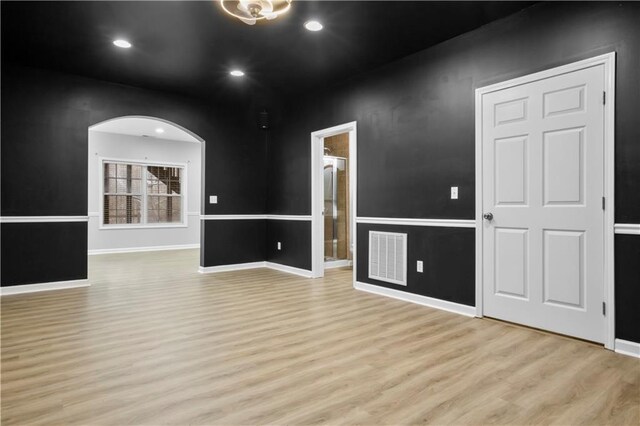 unfurnished room featuring light hardwood / wood-style floors