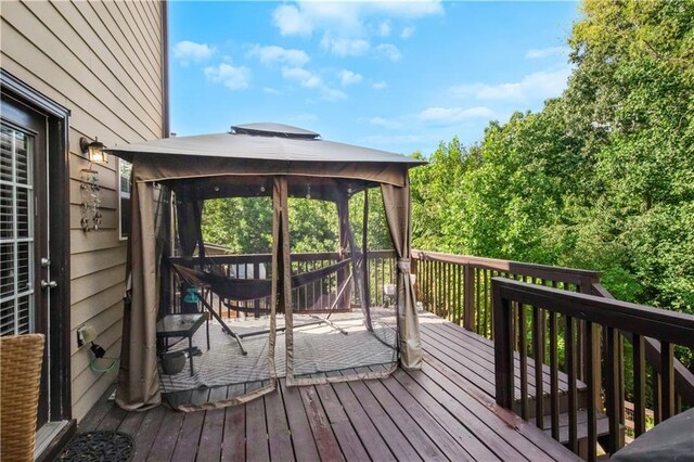 wooden deck featuring a gazebo