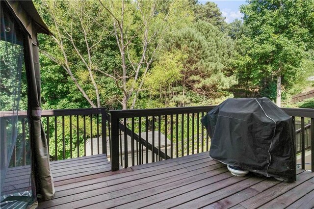 wooden deck with grilling area