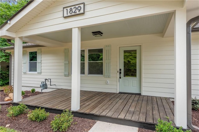 property entrance featuring a wooden deck