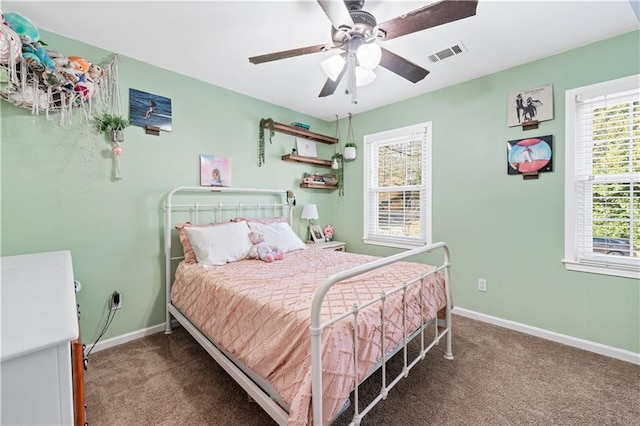 bedroom featuring ceiling fan and carpet