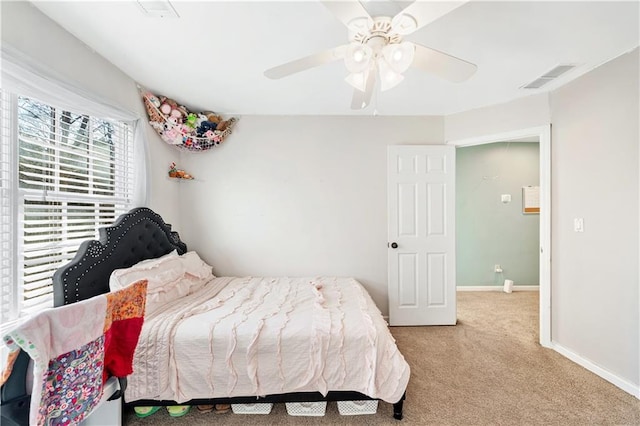 carpeted bedroom with ceiling fan