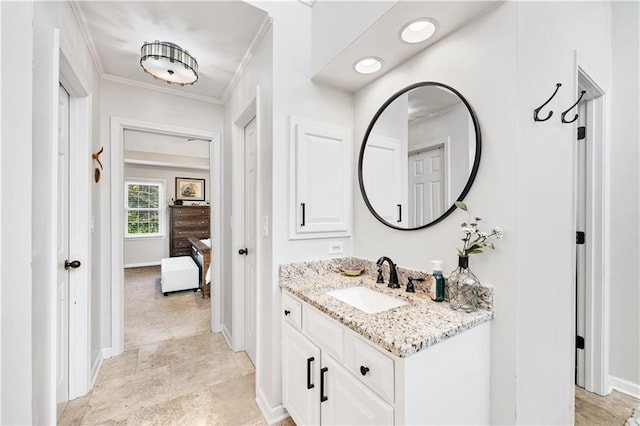 bathroom featuring vanity and ornamental molding