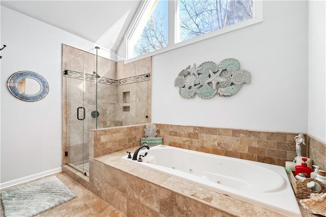 bathroom featuring shower with separate bathtub and vaulted ceiling