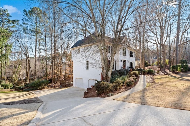 view of side of home with a garage