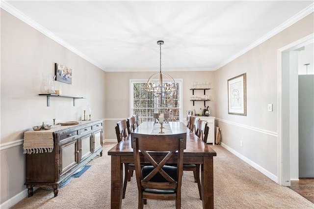 dining area with an inviting chandelier, light colored carpet, and crown molding