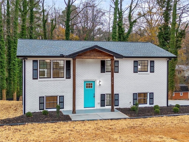 raised ranch featuring a patio