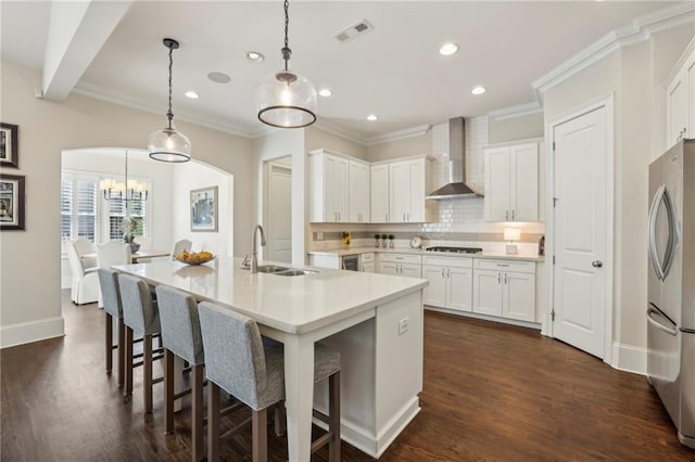 3005 Evelyn Ln, Alpharetta, GA 30004 - kitchen featuring wall chimney range hood, freestanding refrigerator, stovetop, tasteful backsplash, and recessed lighting