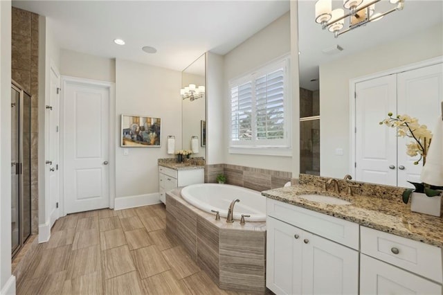 3005 Evelyn Ln, Alpharetta, GA 30004 - bathroom featuring a chandelier, a stall shower, and two vanities