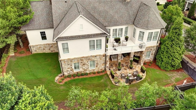 3005 Evelyn Ln, Alpharetta, GA 30004 - rear view of property with stone siding, a wooden deck, roof with shingles, and a patio area
