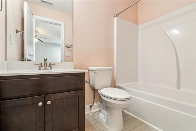 full bathroom with shower / bathtub combination, vanity, and toilet