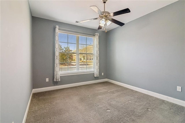 unfurnished room with ceiling fan and carpet flooring