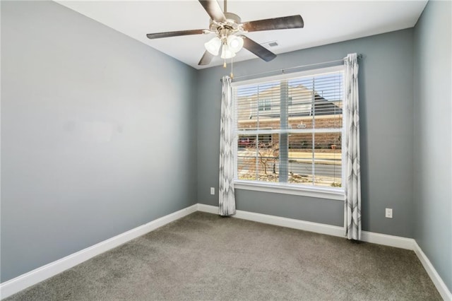 spare room with ceiling fan and carpet flooring