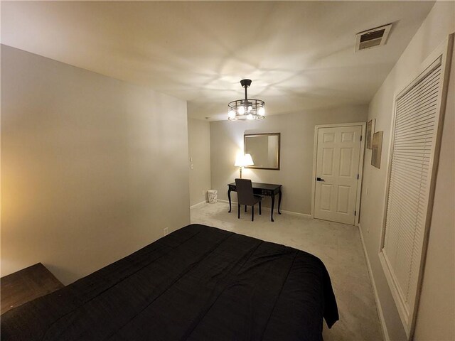 bedroom featuring light colored carpet