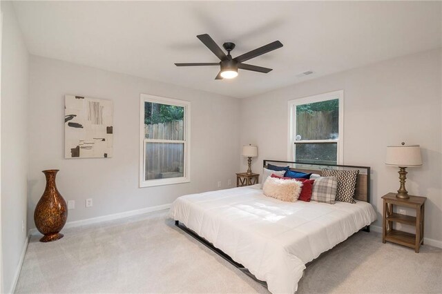 carpeted bedroom with ceiling fan