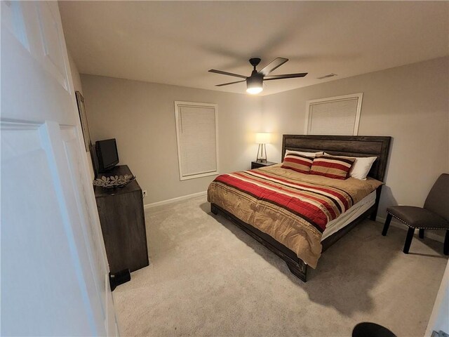 bedroom featuring ceiling fan and light colored carpet