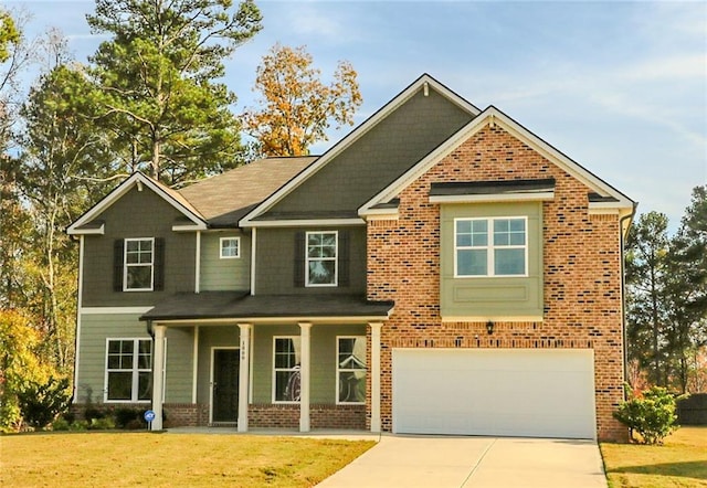 craftsman-style home featuring a front lawn and a garage