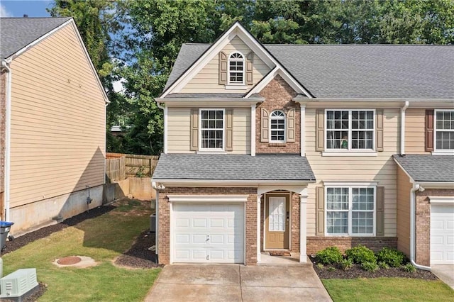 4161 Magnolia Glen Walk, Norcross, GA 30093 - traditional home with brick siding, a garage, driveway, and a shingled roof