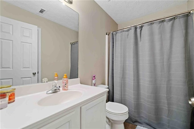 4161 Magnolia Glen Walk, Norcross, GA 30093 - full bathroom with toilet, vanity, a textured ceiling, and a shower with shower curtain