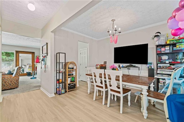 4161 Magnolia Glen Walk, Norcross, GA 30093 - dining space with a textured ceiling, wood finished floors, a chandelier, baseboards, and ornamental molding
