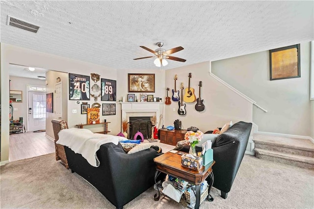 4161 Magnolia Glen Walk, Norcross, GA 30093 - carpeted living area with ceiling fan, a textured ceiling, baseboards, and a fireplace
