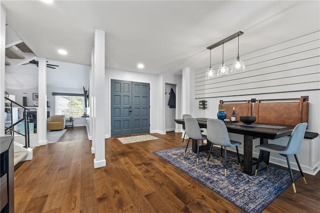 dining space featuring stairway, recessed lighting, baseboards, and wood finished floors