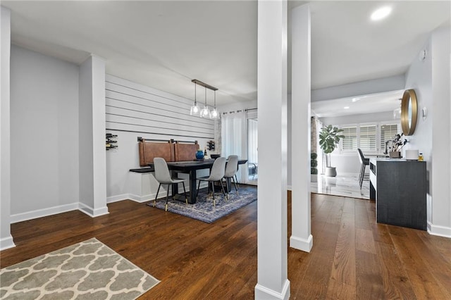 dining room with wood finished floors and baseboards