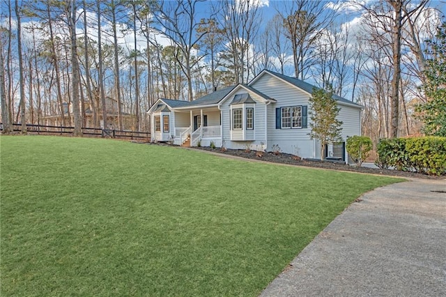 view of front facade with covered porch and a front lawn