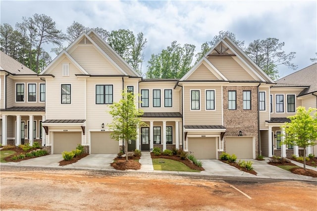 4948 Sudbrook Way, Peachtree Corners, GA 30092 - view of property featuring a standing seam roof, driveway, and a garage