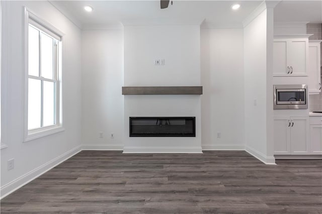 4948 Sudbrook Way, Peachtree Corners, GA 30092 - unfurnished living room featuring baseboards, ornamental molding, a glass covered fireplace, and dark wood-style floors