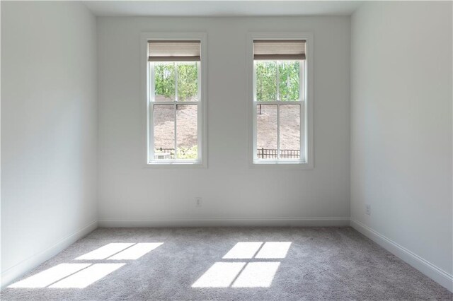 4948 Sudbrook Way, Peachtree Corners, GA 30092 - empty room featuring carpet floors, baseboards, and a healthy amount of sunlight