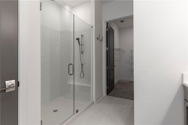 4948 Sudbrook Way, Peachtree Corners, GA 30092 - full bath with visible vents, marble finish floor, baseboards, a spacious closet, and a shower stall