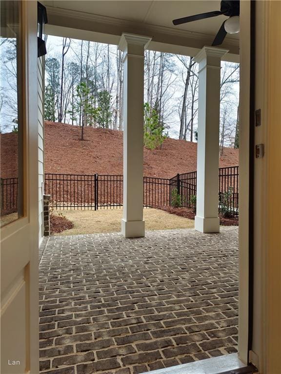 view of patio / terrace featuring fence and a ceiling fan