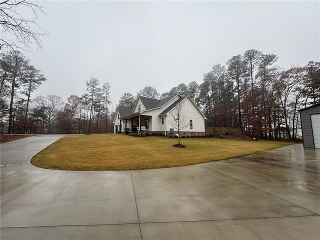 view of property exterior with a yard