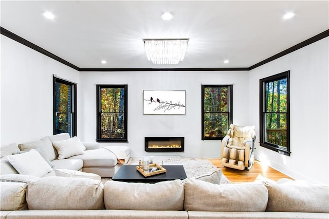 living room with light hardwood / wood-style flooring and ornamental molding