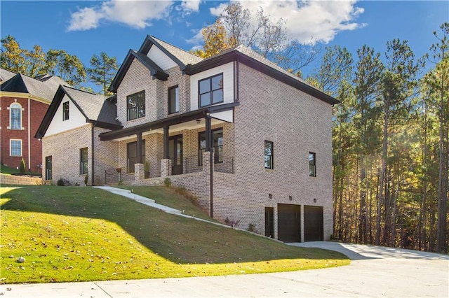 view of home's exterior featuring a yard and a garage