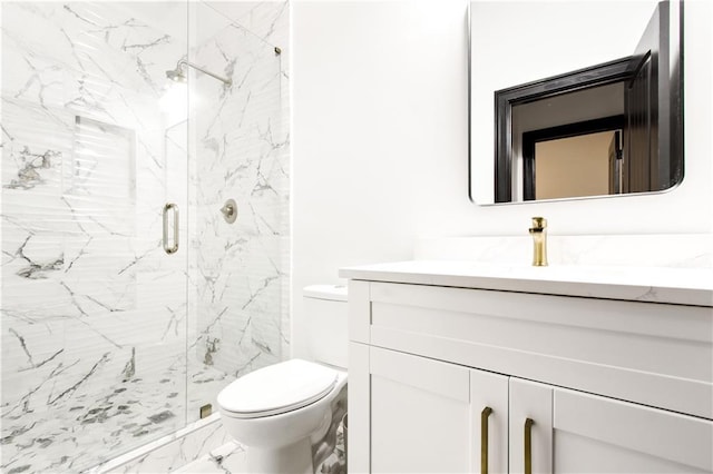 bathroom featuring vanity, toilet, and walk in shower