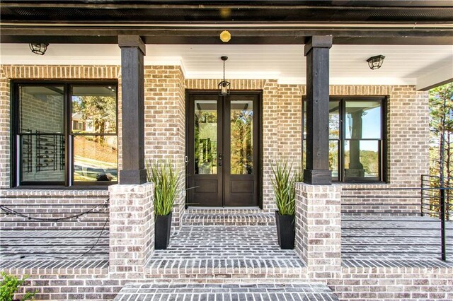 view of exterior entry featuring french doors