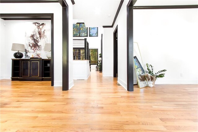 corridor with light wood-type flooring