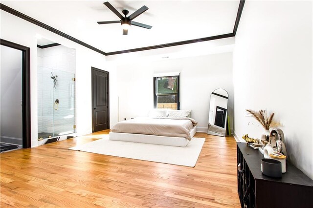 bedroom featuring ceiling fan, crown molding, and light hardwood / wood-style floors